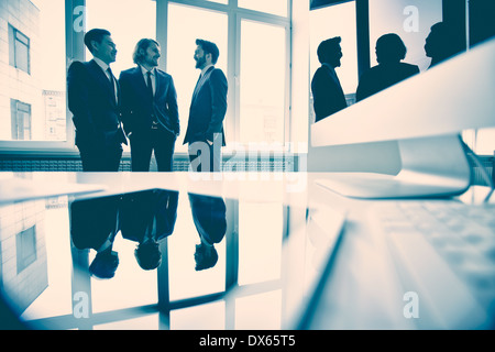 Business partners discussing new strategy in the meeting room Stock Photo