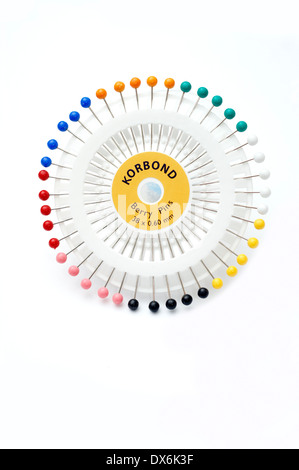 Carousel of berry dressmaking needlework pins for sewing (seams hems etc) on a white background Stock Photo