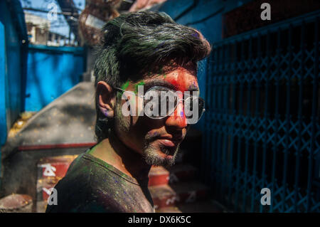 Dhaka, Bangladesh. 16th Mar, 2014. The colorful festival of Holi is celebrated on Phalgun Purnima which comes in February end or early March. Holi festival has an ancient origin and celebrates the triumph of 'good' over 'bad'. The colorful festival bridges the social gap and renew sweet relationships. On this day, people hug and wish each other 'Happy Holi'. In Bangladesh Holi is celebrated in Shakhari Bazar for many years. People from all religion and area come here to enjoy the day and to make the festival more colorful. © Anik Rahman/NurPhoto/ZUMAPRESS.com/Alamy Live News Stock Photo