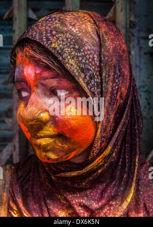 Dhaka, Bangladesh. 16th Mar, 2014. The colorful festival of Holi is celebrated on Phalgun Purnima which comes in February end or early March. Holi festival has an ancient origin and celebrates the triumph of 'good' over 'bad'. The colorful festival bridges the social gap and renew sweet relationships. On this day, people hug and wish each other 'Happy Holi'. In Bangladesh Holi is celebrated in Shakhari Bazar for many years. People from all religion and area come here to enjoy the day and to make the festival more colorful. © Anik Rahman/NurPhoto/ZUMAPRESS.com/Alamy Live News Stock Photo