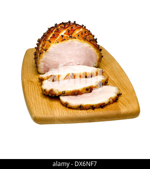 Sliced glazed ham on a board Stock Photo