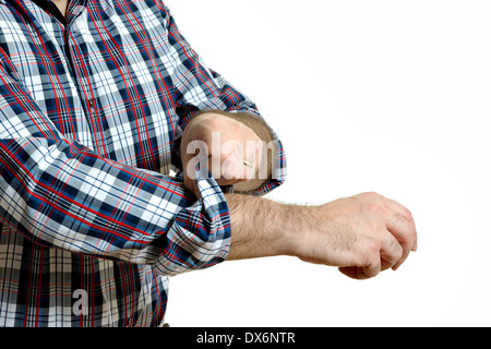 Man in a plaid shirt rolls up his sleeves, isolated on white background Stock Photo