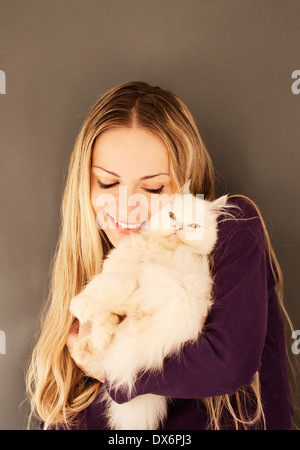 Pretty girl holding a cat Stock Photo