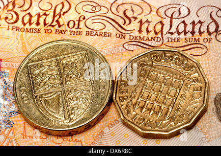 New British pound coin planned for 2017, to help counter growing counterfeiting problems. New design based on the old pre-decimal 3d piece. Stock Photo