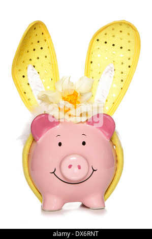 Piggy bank wearing easter bunny ears cutout Stock Photo