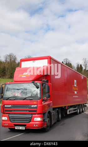 A Royal Mail truck traveling around a roundabout in Coulsdon, Surrey, England. Stock Photo