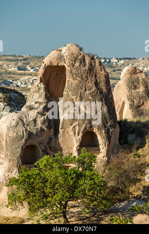 Dwellings in fairy chimneys, Red Valley, Cappadocia, Turkey Stock Photo