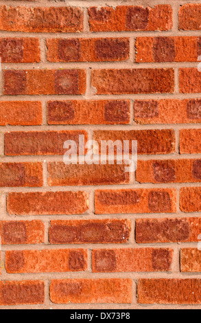 Red brick wall with brown-grey pointing, portrait, medium shot. Stock Photo