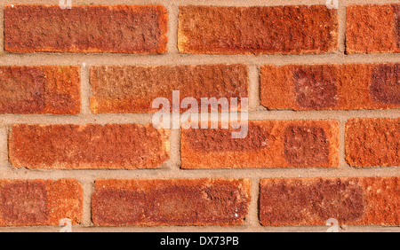 Red brick wall with brown-grey pointing, landscape, medium close. Stock Photo