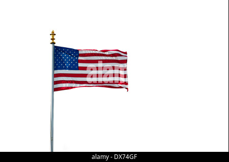 American flag showing US Stars and Stripes blowing in the wind on white background Stock Photo