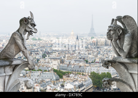 Stone demons gargoyle und chimera with Paris city on background. View from Notre Dame de Paris Stock Photo
