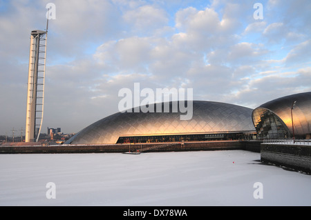 River Clyde Canting Basin by Glasgow Science Centre, frozen over during bad winter of 2010. Glasgow Tower and IMAX cinema Stock Photo