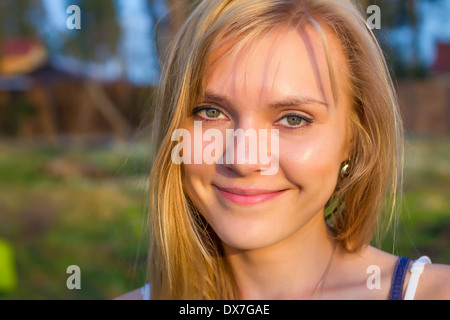 Beautiful young blond woman outdoors Stock Photo