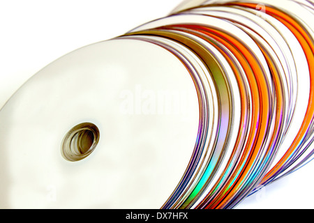 close up of collection of orange and white compact discs Stock Photo