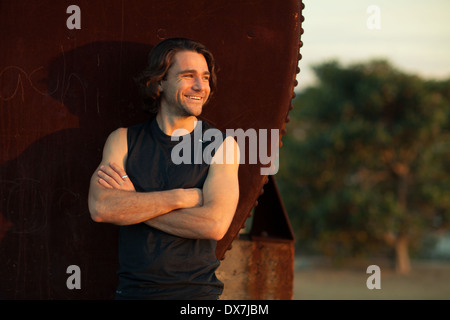 A young man in thought before an early-morning workout Stock Photo