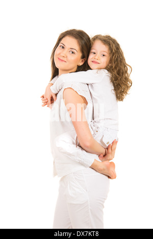 Mother offering piggy back ride to her daughter isolated on white background Stock Photo
