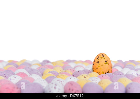 Candy covered chocolate easter eggs with one rising above the others, space above for your own message.
