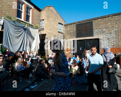 People in Ezra St. near Columbia Road Flower Market London E2 UK KATHY DEWITT Stock Photo