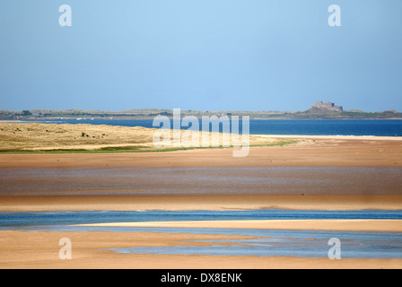 View of Lindisfarne over Budle Bay, Northumberland Stock Photo