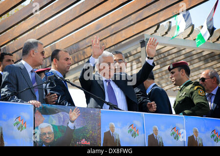 Ramallah, West Bank, Palestinian Territory. 20th Mar, 2014. Palestinian President Mahmoud Abbas (C Front) waves to his supporters during a rally in the West Bank city of Ramallah, on March 20, 2014. Abbas said on Thursday that he will advocate Palestinian rights during negotiations with Israel, as the United States urges Palestinians to extend the peace talks. Credit:  Fadi Arouri/Xinhua/Alamy Live News