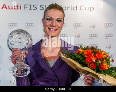 German skier Maria Hoefl-Riesch poses with the crystal globe for winning the overall women's downhill competition of the Alpine Skiing World Cup in Munich, Germany, 20 March 2014. Three-time Olympic champion Maria Hoefl-Riesch of Germany said on 20 March 2014 that she is ending her skiing career with immediate effect. The all-rounder Hoefl-Riesch was the most successful German skier in recent years as she won super-combined and slalom gold at the 2010 Olympics in Vancouver, super-combined gold at the 2014 Olympics in Sochi, two world championship titles and the 2011 overall World Cup. PHOTO: M