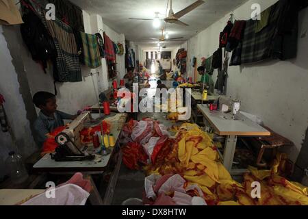 Dhaka 20 march 2014.The number of children working at different tailors’ shops in Keraniganj on the outskirts of the capital in Dhaka .The children, some preteens, works only for tips and get no salaries in small businesses that have no fire safety measures. Stock Photo