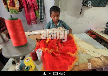 Dhaka 20 march 2014.The number of children working at different tailors’ shops in Keraniganj on the outskirts of the capital in Dhaka .The children, some preteens, works only for tips and get no salaries in small businesses that have no fire safety measures. Stock Photo