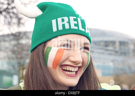 Portrait of young smiling Irish girl attending Six Nations Rugby tournament at Aviva Stadium in Dublin city, Ireland Stock Photo
