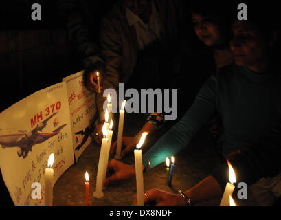 Amritsar, India - 20th March 2014: Members of Akhil Bharatiya Human Rights Organisation holding a candle light vigil for the safety of the passengers of the missing Malaysian plane, in Amritsar on Thursday. The missing aircraft disappeared one week ago carrying 227 passengers and 12 crew, baffling the international rescue and search teams who have found no remains or clues in the waters surrounding South East Asia. All passengers and crew are currently under investigation for possible sabotage although no evidence of such activity has been found. (Photo by Prabhjot Gill/Pacific Press)