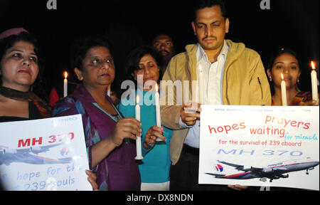 Amritsar, India - 20th March 2014: Members of Akhil Bharatiya Human Rights Organisation holding a candle light vigil for the safety of the passengers of the missing Malaysian plane, in Amritsar on Thursday. The missing aircraft disappeared one week ago carrying 227 passengers and 12 crew, baffling the international rescue and search teams who have found no remains or clues in the waters surrounding South East Asia. All passengers and crew are currently under investigation for possible sabotage although no evidence of such activity has been found. (Photo by Prabhjot Gill/Pacific Press)