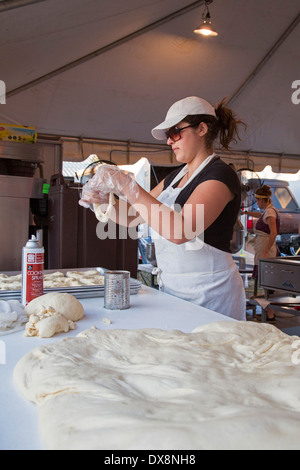Tampa, Florida - A woman makes pastries at the Florida State Fair. Stock Photo