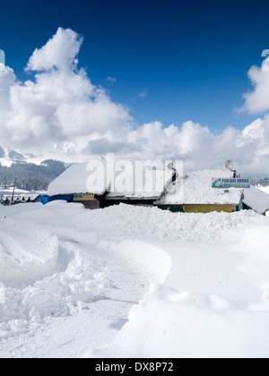India, Kashmir, Gulmarg, Himalayan Ski Resort, shops and resturants almost buried in heavy snowfall Stock Photo