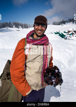 India, Kashmir, Gulmarg, Himalayan Ski Resort, happy vendor selling sunglasses Stock Photo