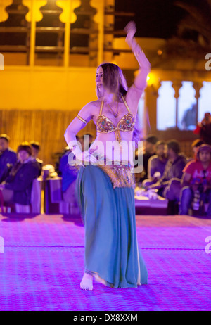 Belly dancer dancing a belly dance on a desert safari, Dubai, UAE, United Arab Emirates, Middle East Stock Photo