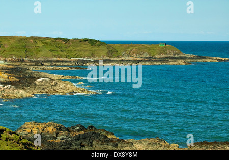 Sea view from coastal path of rocky shoreline at Porth Ysglaig near Tudweiliog on the Lleyn Peninsula North Wales UK in summer Stock Photo