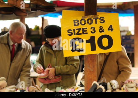 Chesterfield Flee Market And Fruit And Vegetables .Derbyshire,UK. Old Shoes & Boots For Sale . Stock Photo