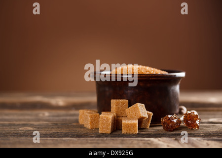 Brown sugar cubes and candy sugar sticks Stock Photo