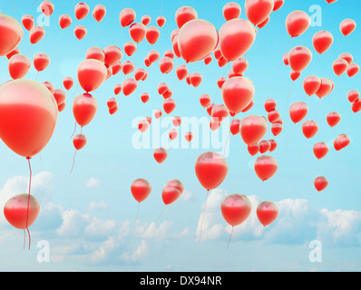 Hundreds of the small red flying balloons Stock Photo