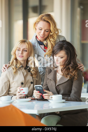 Adult girlfriends in the cosy coffee shop Stock Photo