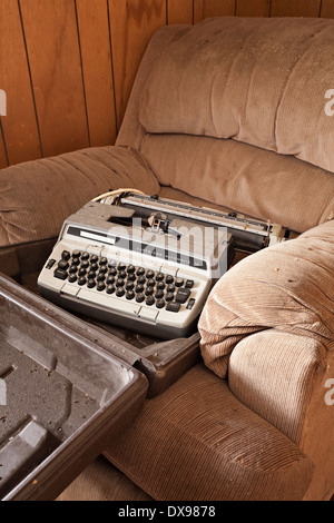 An old typewriter found in an abandoned house in the District of Parry Sound in Ontario, Canada. Stock Photo