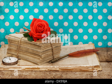 old love letters and postcards with pink rose flower isolated on white background. Stock Photo