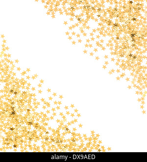 star shaped golden confetti on white background. festive background Stock Photo