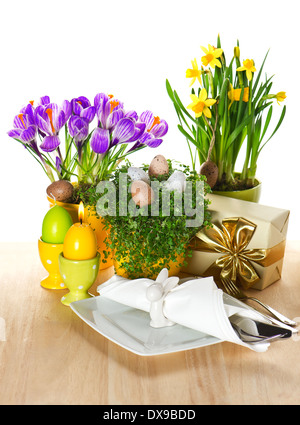 festive easter table setting with spring flowers and eggs decoration on white background Stock Photo