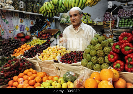 Muslim seller in a fruit shop at the Mercado Central de Abastos. Ceuta .North Africa. Spain. ( Photo by Jordi Camí ) Stock Photo