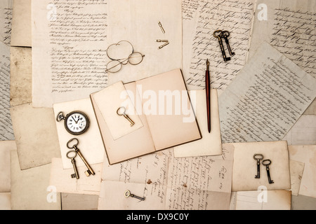 open book, vintage accessories, old letters and post cards. nostalgic background Stock Photo