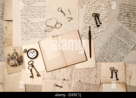 open book, vintage accessories, old letters and post cards. nostalgic background Stock Photo