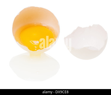 Broken egg with yolk Isolated on white background. Stock Photo