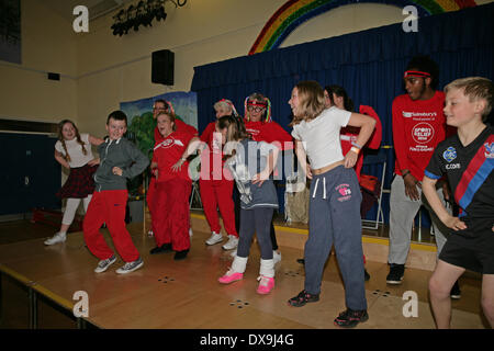 West Wickham,UK. 21st Mar, 2014. West Wickham Sainsbury's Staff and local school children raise funds for Sport Relief by taking part in a Zumbatomic class run by Stephaneez School of Dance Credit:  Keith Larby/Alamy live News Stock Photo