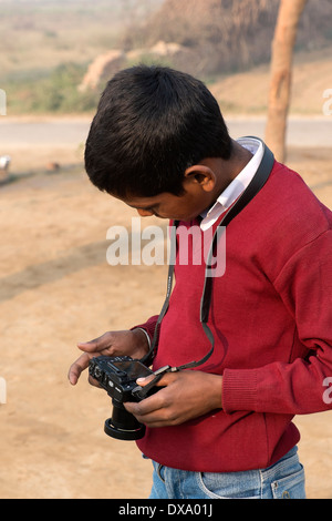 India, Uttar Pradesh, Agra, boy looking at the back of a modern digital camera Stock Photo