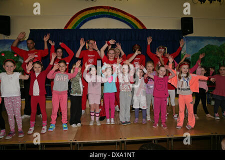 West Wickham, UK. 21st of Mar, 2014. West Wickham Sainsbury's Staff  raise funds for Sport relief by taking  part in a Zumbatomic class run by Stephaneez School of Dance at Wickham Common Primary Schoo Credit: Keith Larby/Alamy live News Stock Photo